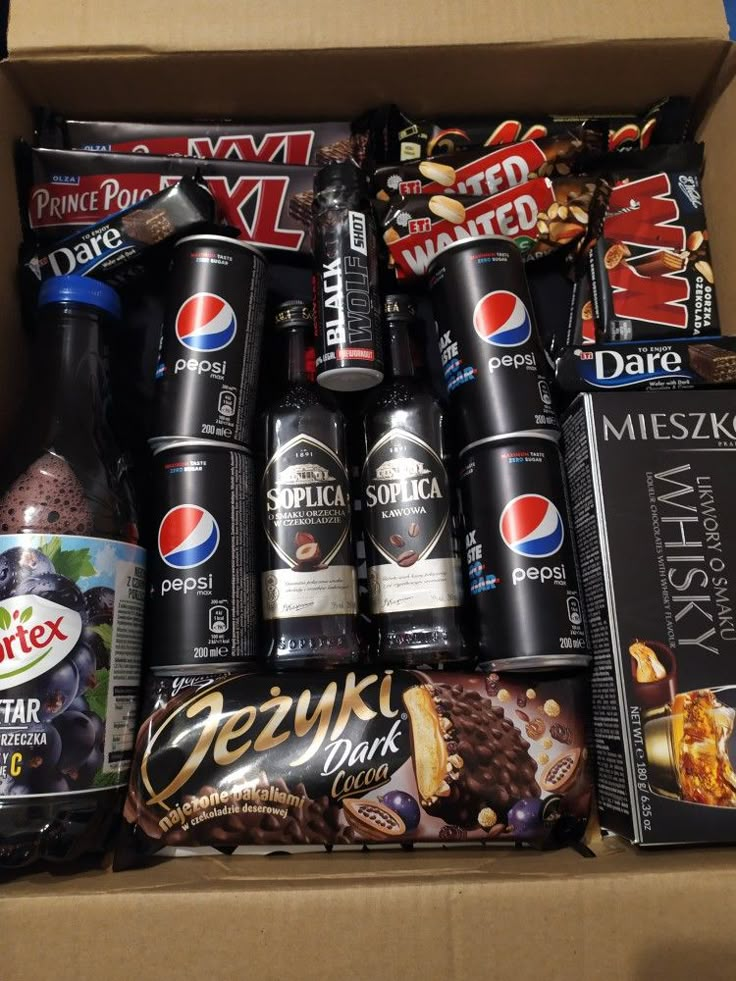 a box filled with different types of drinks and snacks on top of eachother