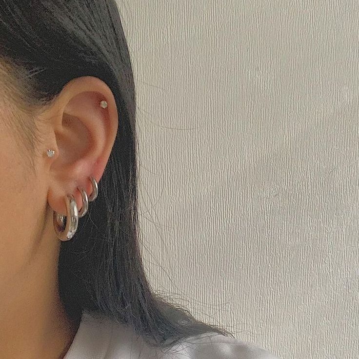 Silver Earrings 3 Holes, Silver Earrings Set Up, Silver Hoop Piercings, Minimal Ear Piercings Silver, Silver Earrings Layered, Mix Gold And Silver Earrings, Silver Hoop Earrings Stack, Layered Silver Earrings, Curated Ears Silver