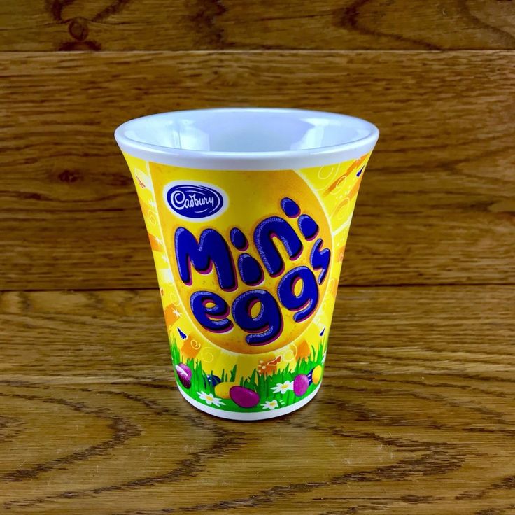 an ice cream cup sitting on top of a wooden table