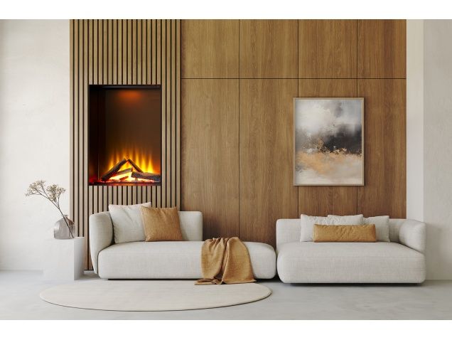 a living room with two white couches and a fire place in the wall behind them