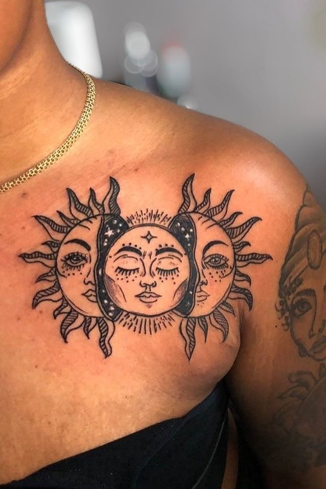 a woman with sun and moon tattoos on her chest