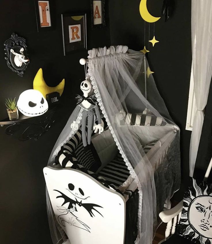 a bedroom decorated in black and white for halloween