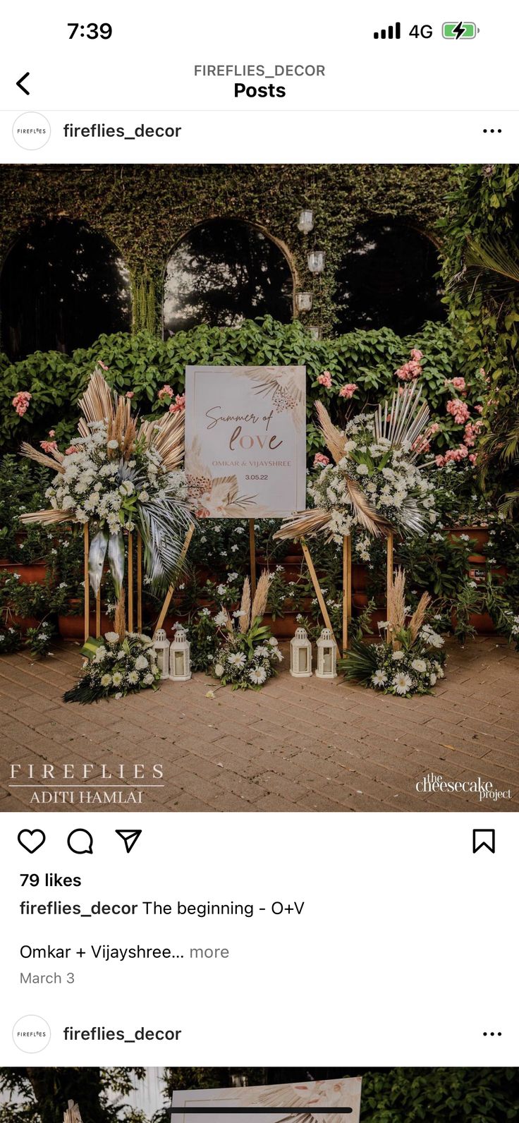 the wedding sign is on display in front of flowers and greenery at this outdoor ceremony