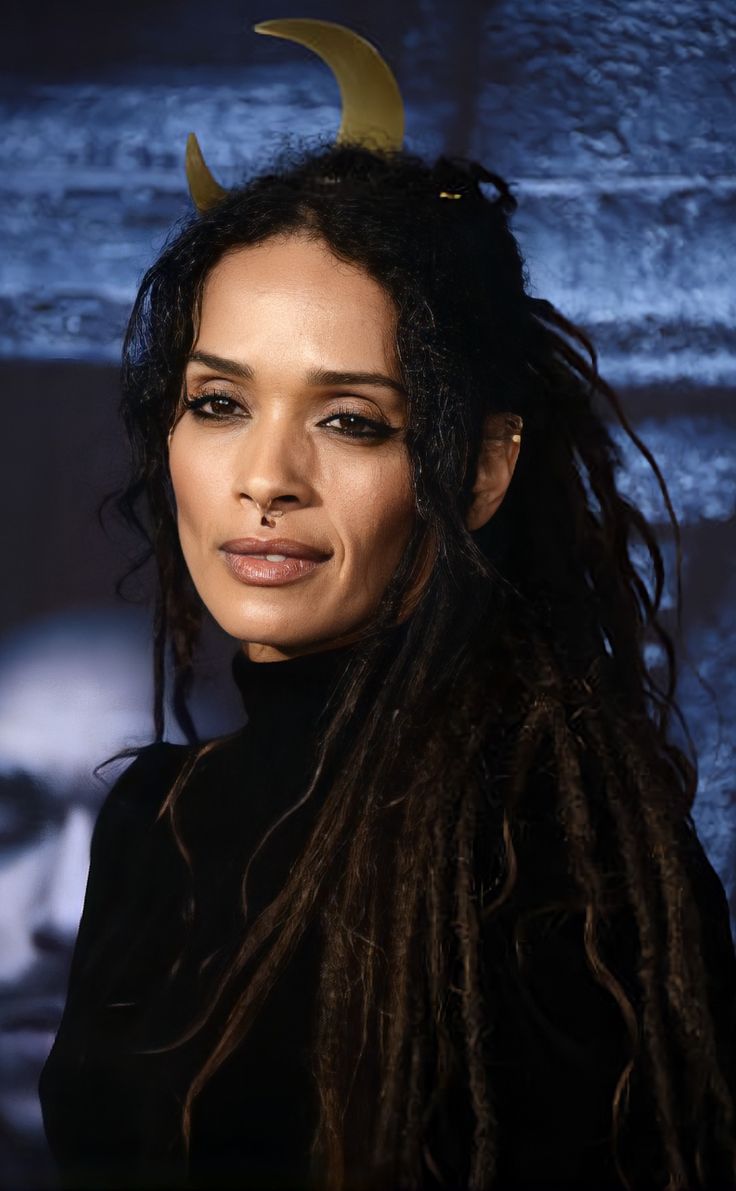 a woman with long dreadlocks and horns on her head