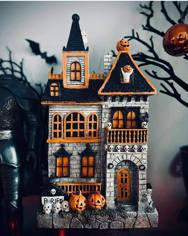 a halloween house with pumpkins and ghost decorations