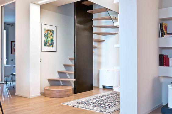 there is a spiral staircase in the living room