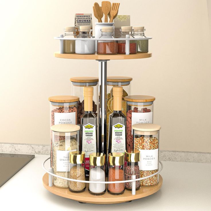 a three tiered spice rack with spices and seasonings on it's sides