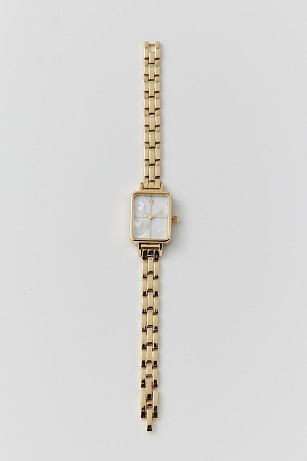 Classic metal rectangle watch. Essential watch style with a linked chain in polished metal complete with a rectangle style face. Features Classic metal rectangle watch Linked banded watch with rectangle face Content + Care Mixed metal, glass Avoid contact with water Imported Size Strap length: 7.24" l Case: .98" x .78" | Classic Metal Rectangle Watch in Gold, Women's at Urban Outfitters Rectangle Womens Watch, Womens Gold Watch Outfit, Long Lasting Jewelry, Gold Square Watches Women, Womans Gold Watch, Vintage Looking Jewelry, Cute Last Minute Birthday Gifts, Small Dainty Watch, Womens Christmas List 2024