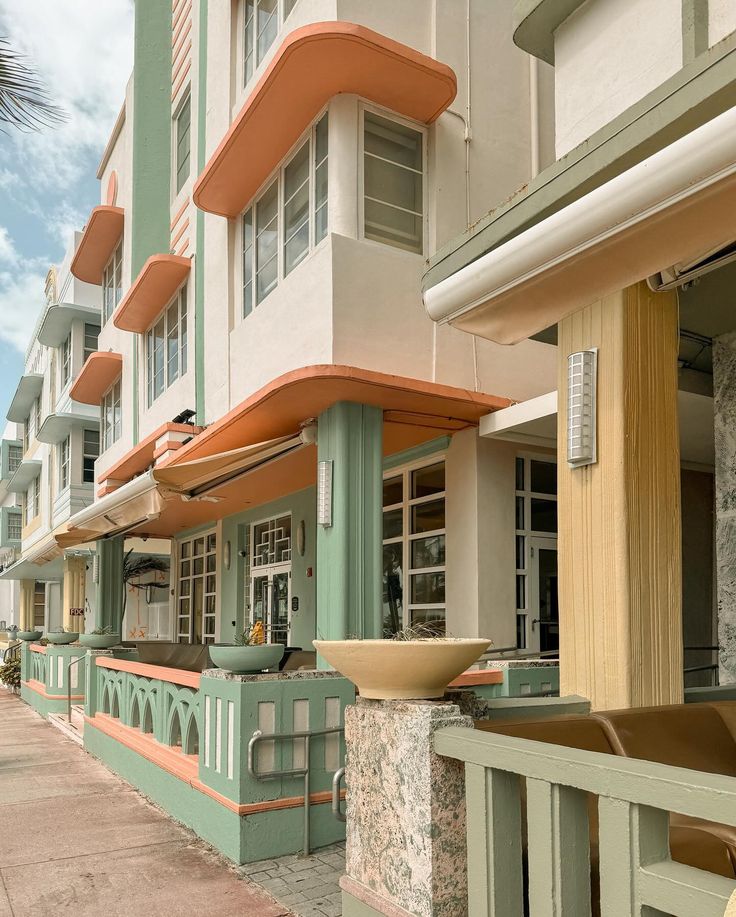 a row of multi - story buildings on the side of a street