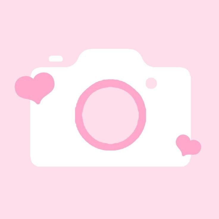 a pink camera with hearts on it