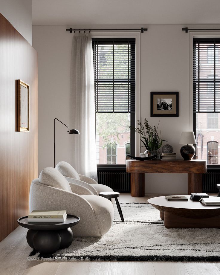 a living room filled with furniture and windows