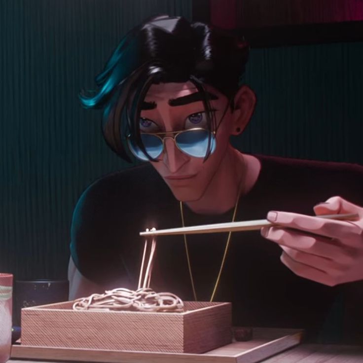 a man wearing sunglasses and holding chopsticks in front of a box with noodles on it