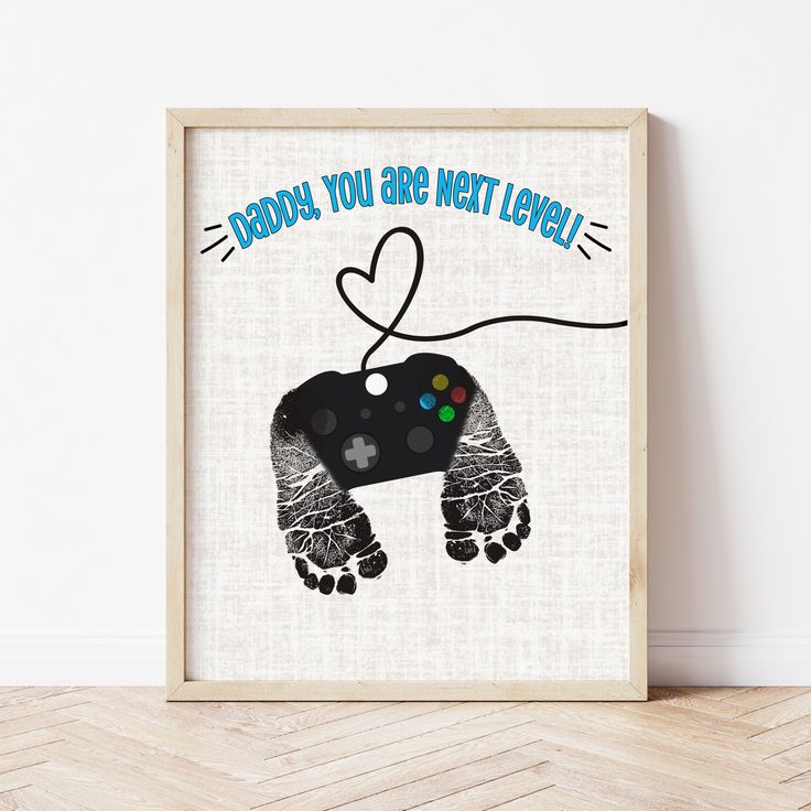 Father's Day Footprint Art | Gamer Dad Gifts | Ollie + Hank Gamer Fathers Day Gifts From Kids, Fathers Day Gifts Ideas Newborn, Father’s Day Footprint, Fathers Day Pottery Painting Ideas, Dads First Birthday Gift From Baby, Father’s Day Canvas Crafts, Father’s Day Canvas, Gamer Dad Gifts Father's Day, Baby Craft Gifts