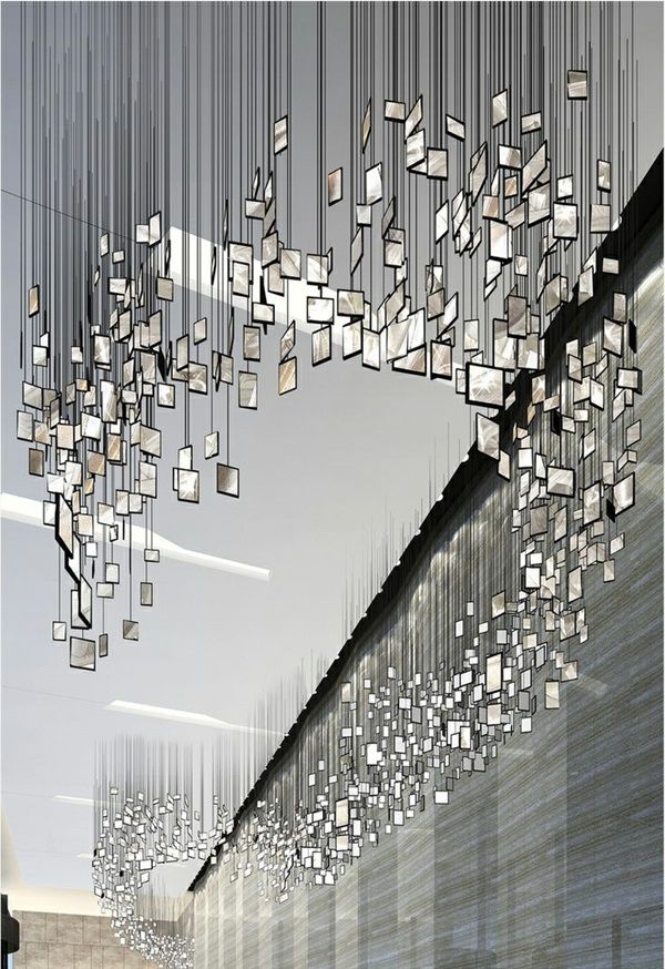 an artistic view of a building with many square objects hanging from it's ceiling