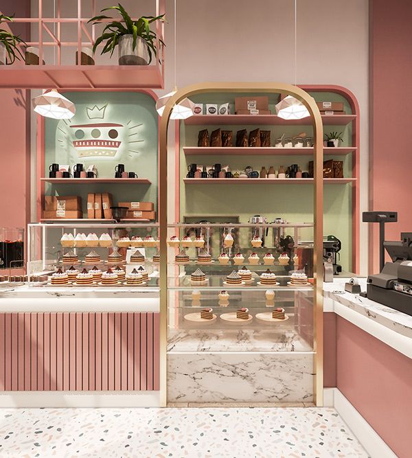 the inside of a store with pink walls and shelves