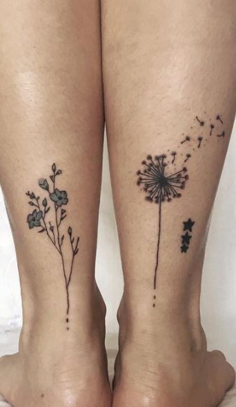 two tattoos on the legs of people with dandelions