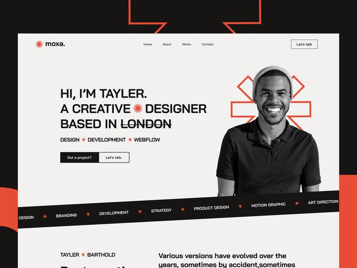 a man is smiling and looking at the camera while standing in front of a website page