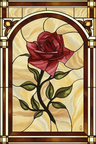 a stained glass window with a rose on it