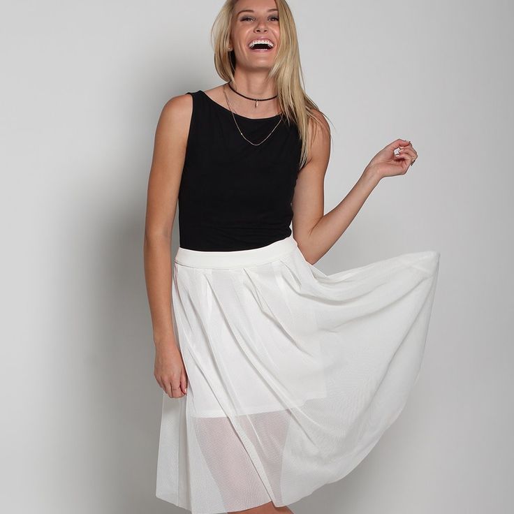 High-Waisted Midi Skirt. Mesh Fabric. Back Zip Closure. Model Is 5'9" / 175 Cm., Wears A S. Content: 100% Polyester; Lining: 100% Polyester Care: Dry Clean Skirt Length: 26" / 66 Cm. White Pleated Skirt For Summer Party, White Knee-length Fitted Pleated Skirt, White Knee-length Pleated Spring Skirt, White Fitted Knee-length Pleated Skirt, Casual White Maxi Skirt For Party, White Pleated Skirt For Party, White Stretch Knee-length Skirt, Knee-length Stretch White Skirt, Chic White Stretch Maxi Skirt