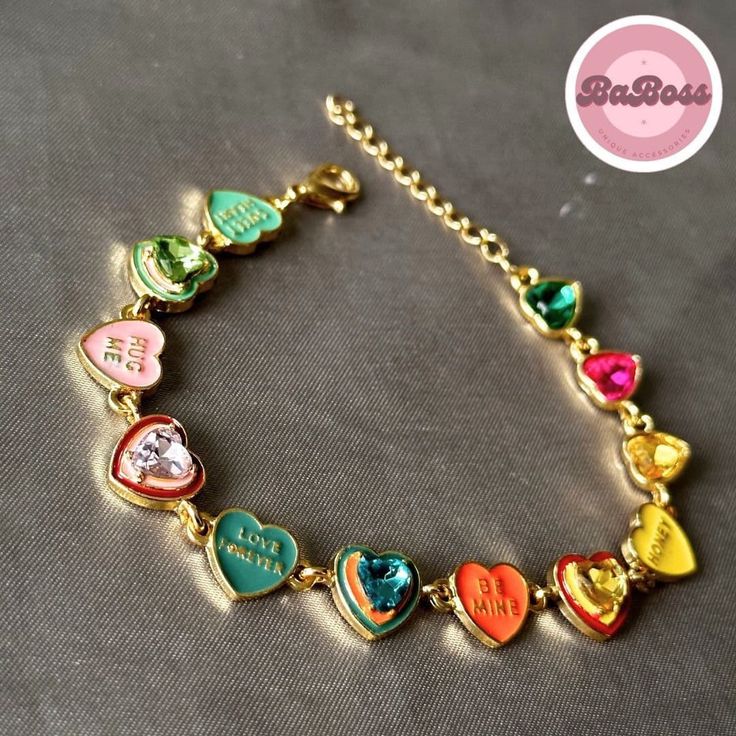 Elevate your style with our exquisite Enchanting Harmony: Vibrant Love Heart Bracelet - a celebration of love and color that captivates hearts and turns every moment into a magical experience. Whether you're stepping out for a casual day with friends or adding a touch of charm to a special occasion, this bracelet effortlessly complements your style. Its versatile design allows you to express your personality with ease. Gold Heart Bracelet For Valentine's Day Party, Multicolor Jewelry For Valentine's Day Party, Pink Heart Bracelet For Valentine's Day Anniversary, Gold Bracelets For Valentine's Day Party, Valentine's Day Party Multicolor Jewelry, Multicolor Heart Beads Jewelry For Valentine's Day, Heart-shaped Multicolor Jewelry For Wedding, Multicolor Heart-shaped Jewelry For Wedding, Heart-shaped Bracelet For Valentine's Day Party