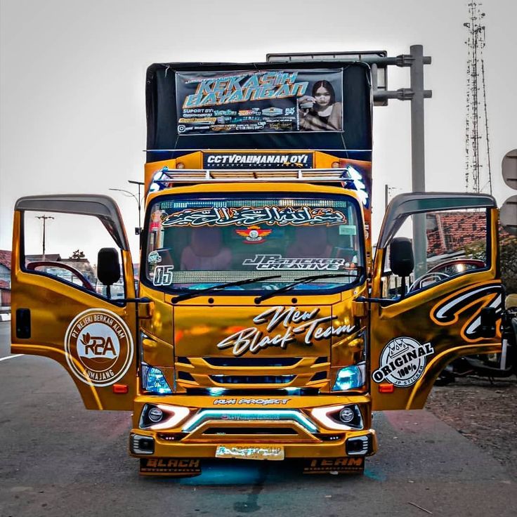 a yellow truck is parked on the side of the road