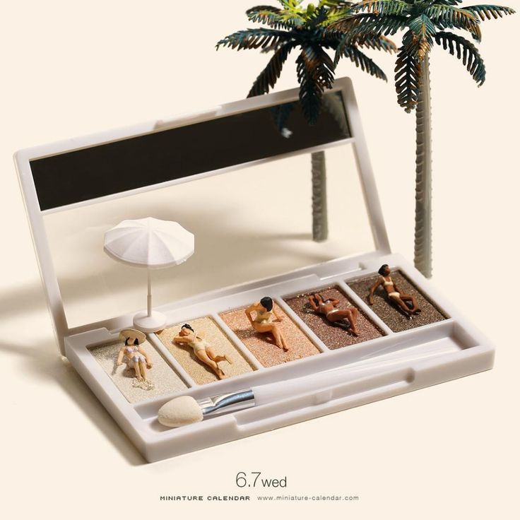 a white tray with four different items in it next to a palm tree and potted plant