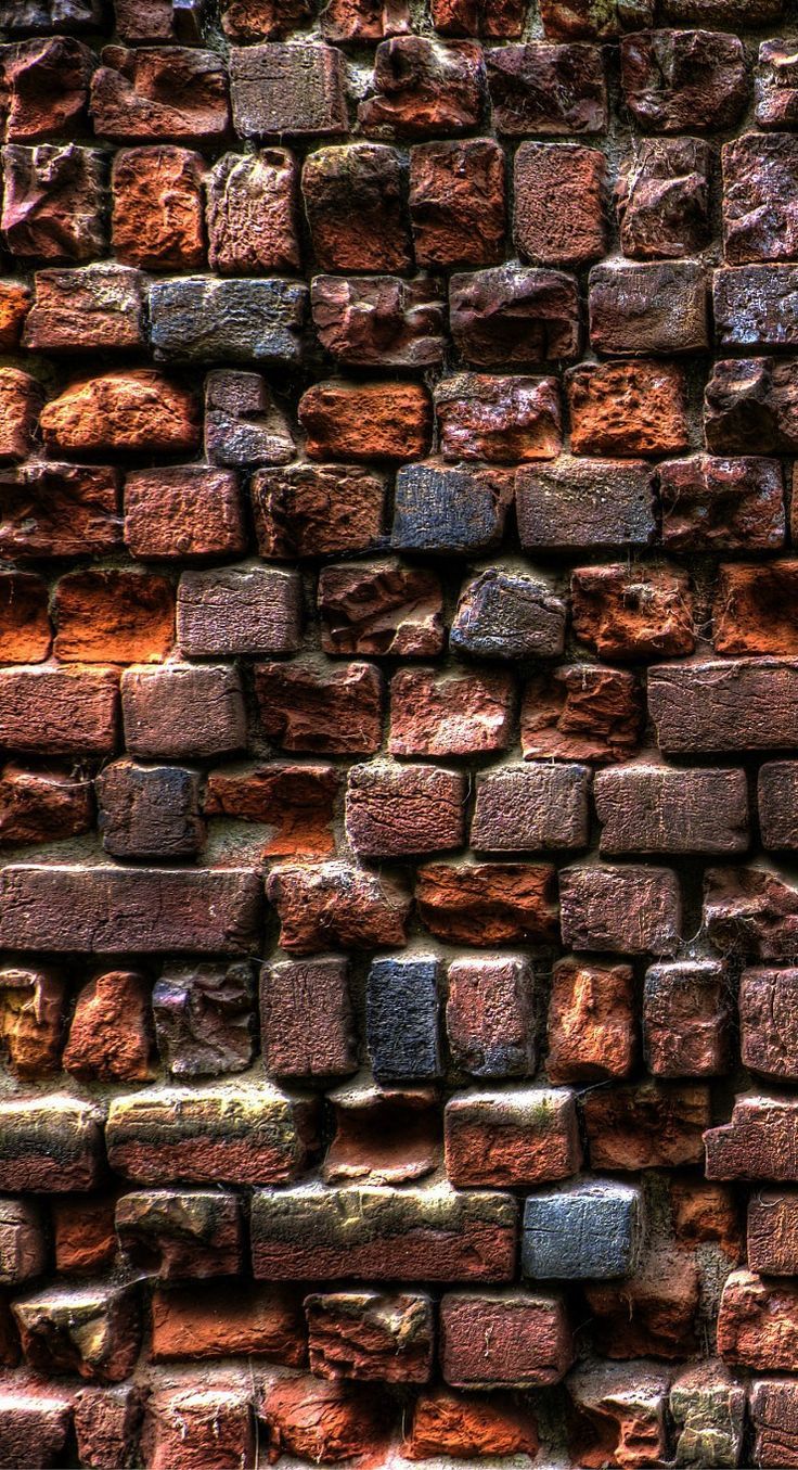 an old brick wall is shown in this image