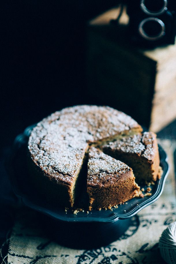 a cake is sitting on a plate with one slice cut out