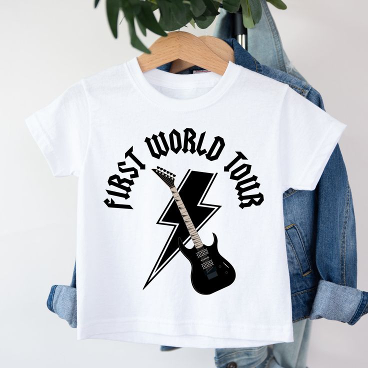 a t - shirt that says first world tour with an electric guitar on it