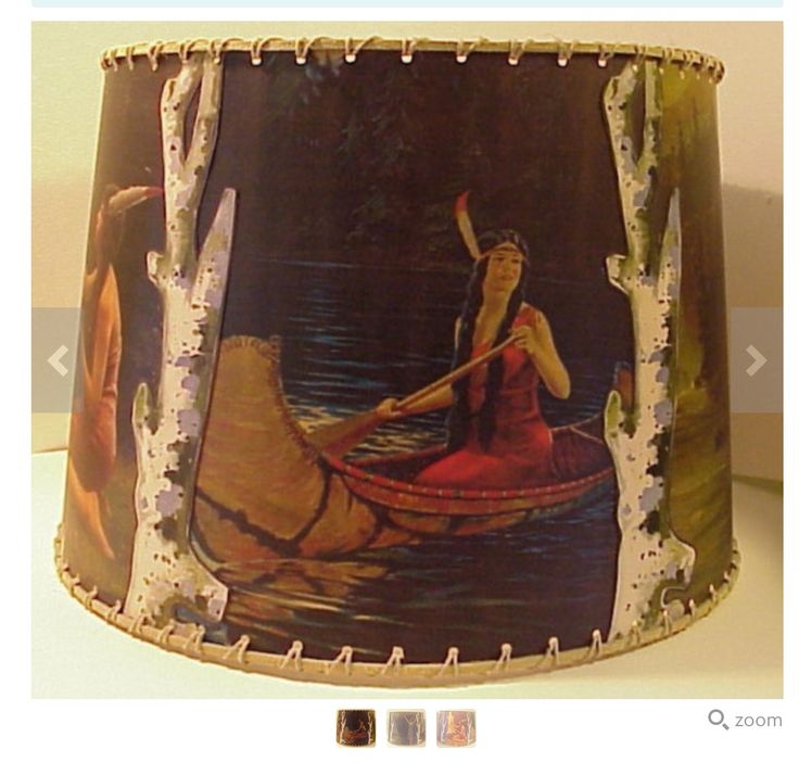 a lamp shade with a painting of a woman in a canoe