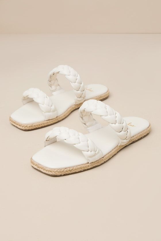 Step into summer with a fresh new look thanks to the Lulus Kennmar Off White Leather Braided Espadrille Slide Sandals! These smooth genuine leather sandals have a comfortable slide-on design, two braided straps, and a square toe bed. Sole is trimmed in beachy jute for a Boho-inspired finish. 0. 5" Rubber heel. Cushioned insole. Rubber sole has nonskid markings. Genuine leather upper. Balance man made materials. Imported. Lulus | Kennmar Off White Leather Braided Espadrille Slide Sandal Heels | S Woven Leather Sandals For Summer, Leather Slides For Beach In Summer, Leather Slides For Summer Beach, Leather Slides For Summer Beach Outings, Summer Leather Sandals For Beach Season, Summer Beach Sandals With Woven Leather, Woven Leather Sandals For Beach Vacation, White Woven Leather Sandals For Summer, Summer Sandals With Braided Straps For Outings