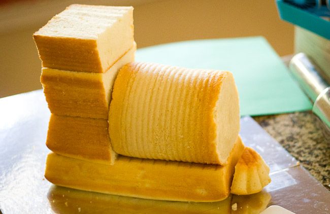 a stack of sliced up bananas sitting on top of a counter next to a knife