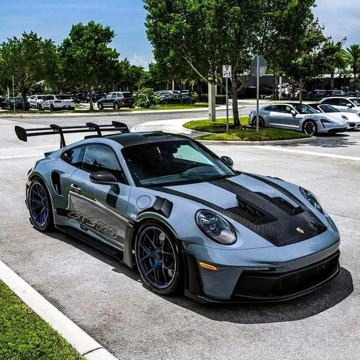 a silver sports car parked in a parking lot