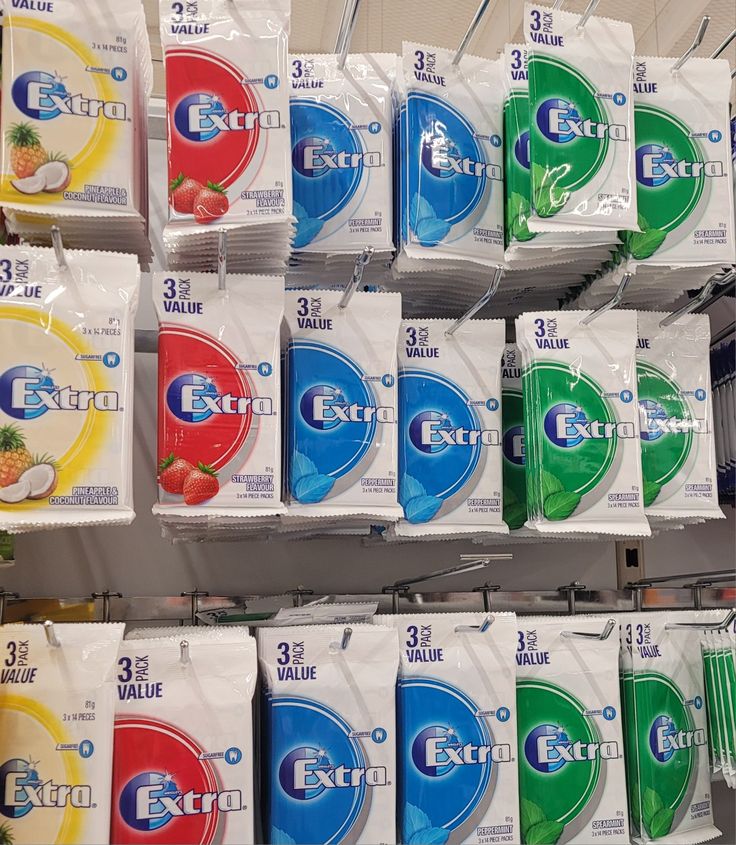 several packs of detergent on display in a store