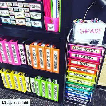 a book shelf filled with lots of books and binders on top of each other