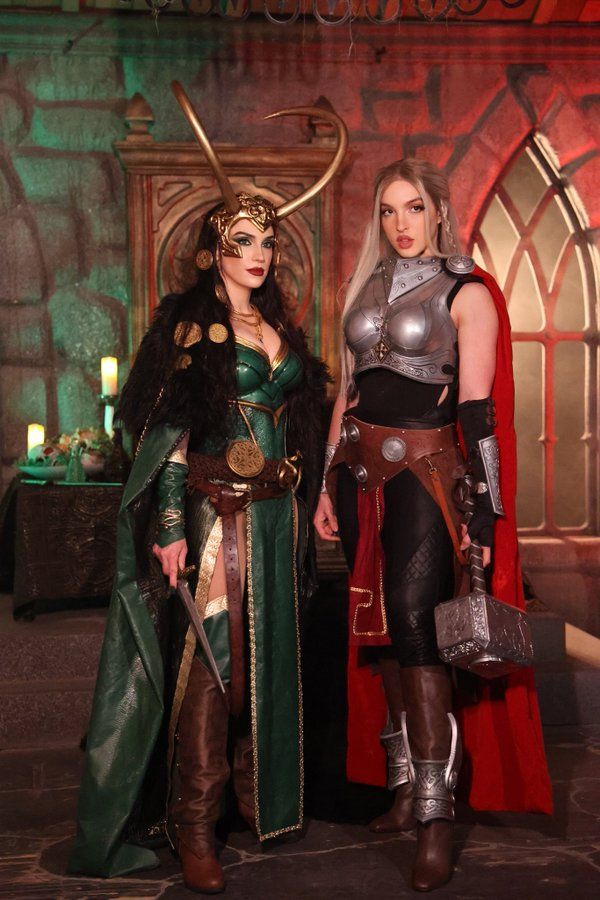 two women in costumes standing next to each other