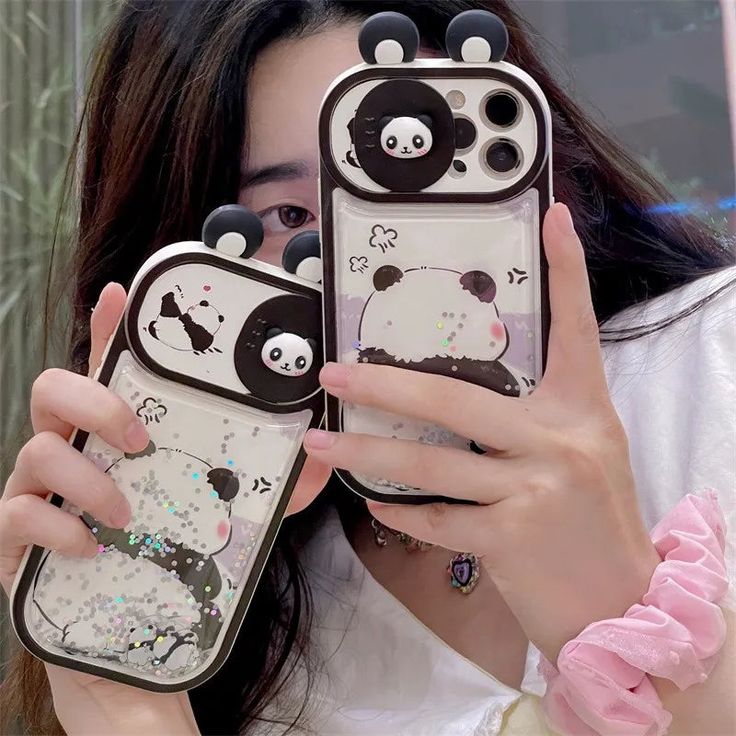 a woman holding up two cell phones with panda bears on them, and the phone case is