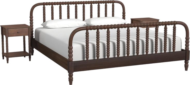 a wooden bed frame with white sheets and pillows on it, next to a night stand