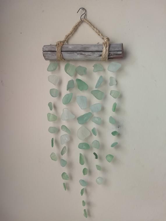 sea glass wind chime hanging on a wall