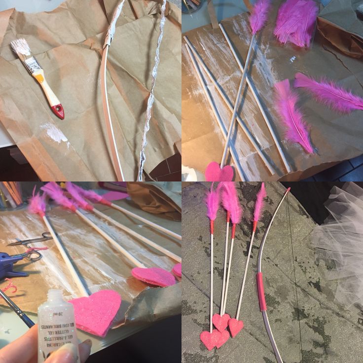 some pink feathers are being made with scissors and glue on top of brown paper bags