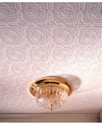 a ceiling with a chandelier hanging from it's side and a light fixture on the other side