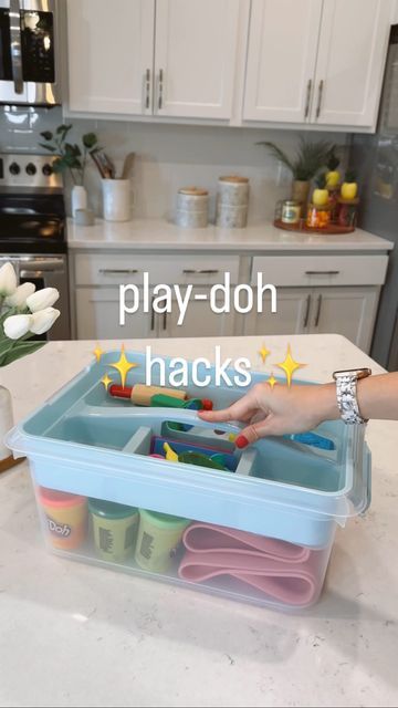 a kitchen counter with play - doh hacks in the middle and a woman's hand reaching for them