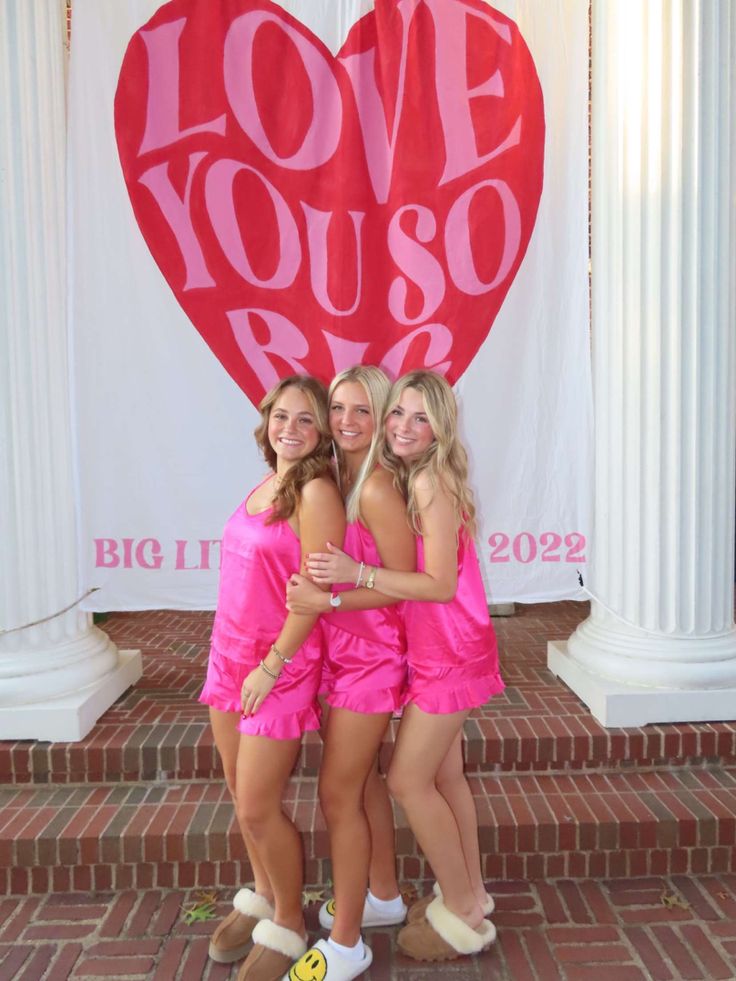 three girls in pink dresses hugging each other with the words love you so written on it