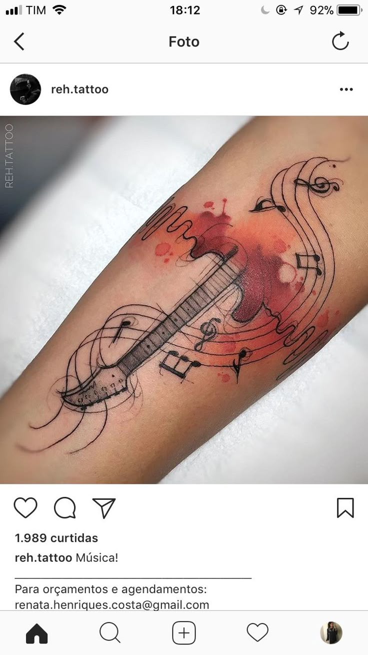 a tattoo with musical notes on it