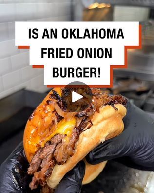 a person in black gloves is holding a sandwich with meat and onions on it that says, is an oklahoma fried onion burger?