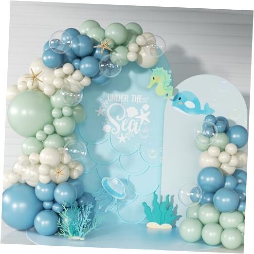 an under the sea balloon arch with blue and white balloons