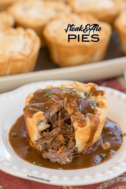 meat and gravy pies on a white plate