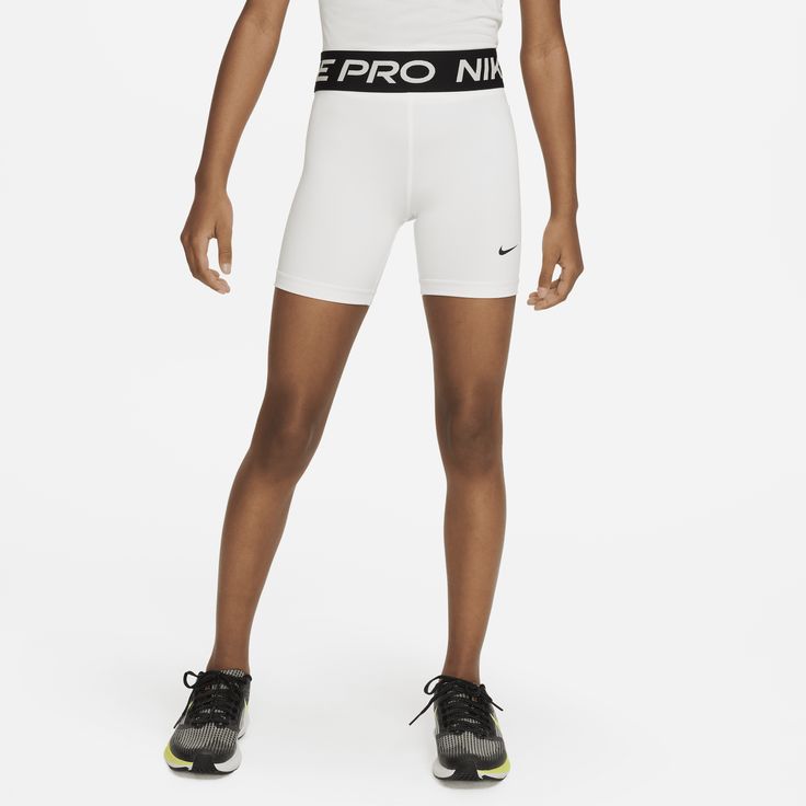 Play and feel like your favorite athlete when you pull on the Nike Pro shorts. Super stretchy fabric hugs your body, so you can feel confident in all sports—from the courts to the outdoor fields. Pro tip: You can wear them alone or underneath your game shorts. It's up to you. Nike White Shorts, White Athletic Shorts With Built-in Shorts For Gym, Nike Sporty Athletic Shorts For Training, Nike Sporty Training Shorts, Sporty Cheerleading Athletic Shorts, Sporty Athletic Shorts For Cheerleading, Functional White Workout Shorts, Nike Athletic Fit Shorts For Sports Events, Nike White Breathable Shorts