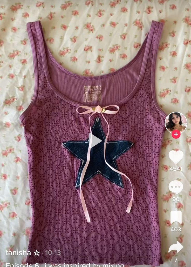 a purple tank top with a blue star on it