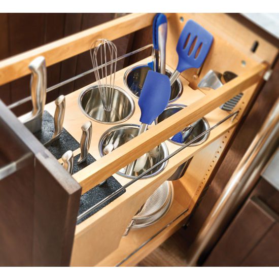 an open drawer with utensils in it